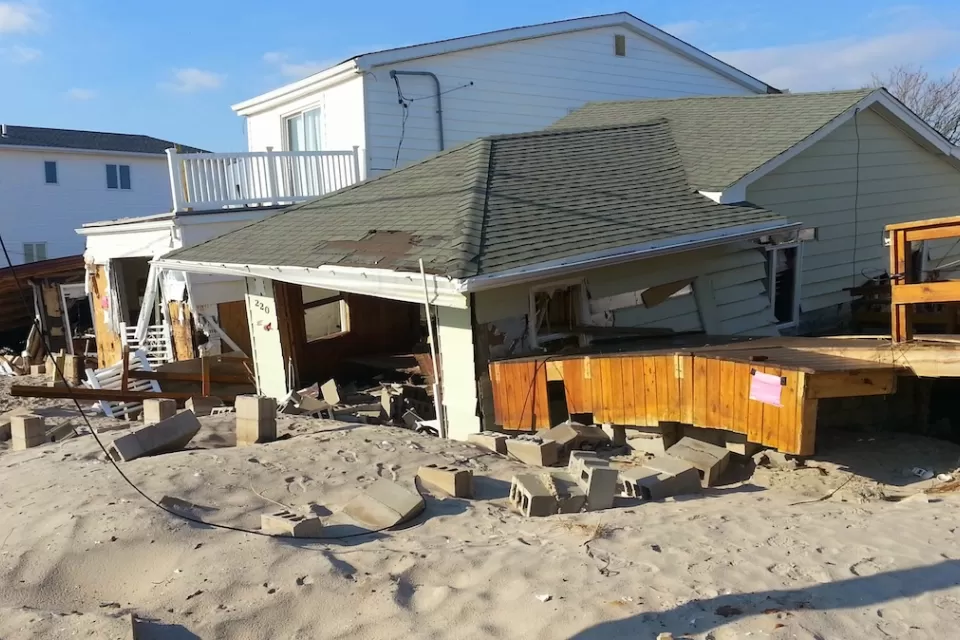 House filled with sand and damaged by debris after Hurricane Sandy.